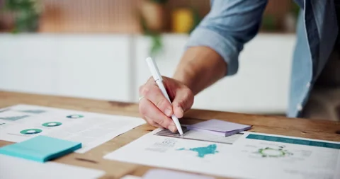 Businessman, hands and writing with documents for analytics, performance or Stock Footage 331057368
