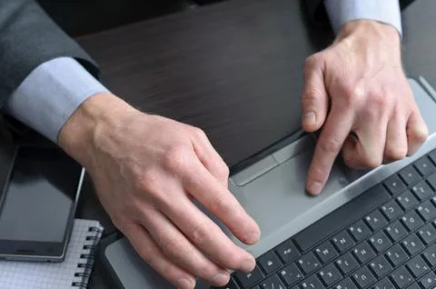 Businessman hands  doing some computer work Stock Photos