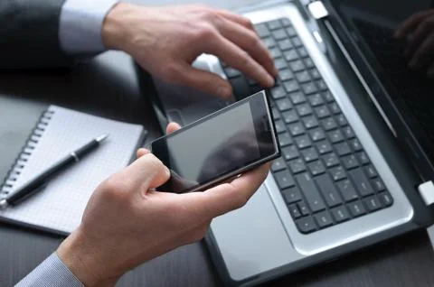 Businessman hands  doing some computer work Stock Photos