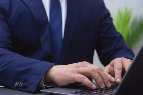 Businessman hands using a computer for business management or data analysis.  Stockfoto's