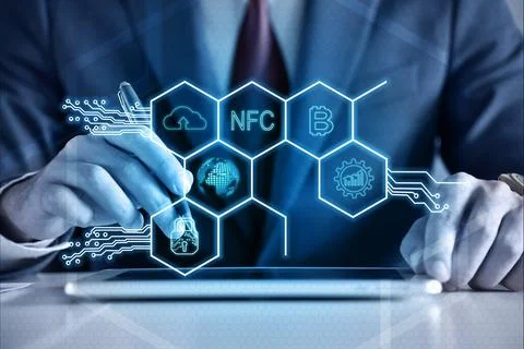 Businessman hands using tablet computer and virtual hexagons hologram 写真素材