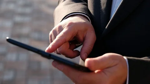 Businessman hands using tablet pc, outdoors Stock Footage 115235734