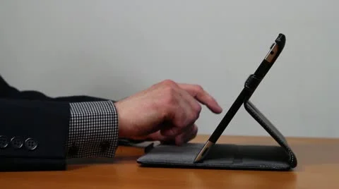 Businessman hands working on tablet with tablet stand Stock Footage 11067653