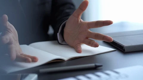 Businessman handss gesture while explaining job description to college Stock Footage 121193483