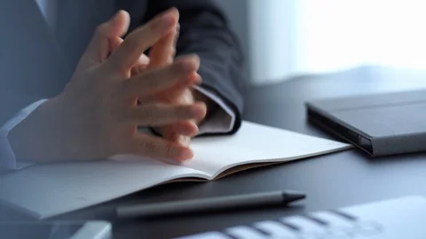 Businessman handss gesture while explaining job description to college Stock Footage 121193484