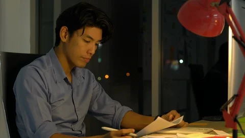 Businessman hard working with desktop computer to late night at office. Stock Footage 109245679