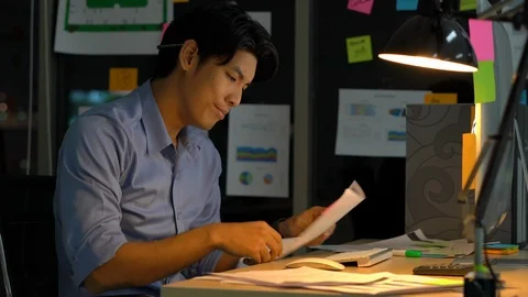 Businessman hard working with desktop computer to late night at office. Stock Footage 109285655