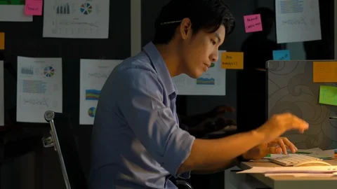 Businessman hard working with desktop computer to late night at office. Stock Footage 109292025