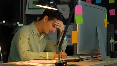 Businessman hard working with desktop computer to late night at office. Stock Footage 109299589