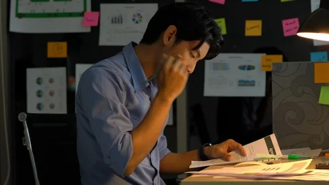 Businessman hard working with desktop computer to late night at office. Stock Footage 109382245