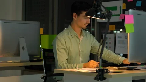 Businessman hard working with desktop computer to late night at office. Stock Footage 109390077