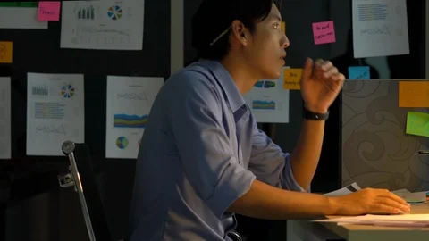Businessman hard working with desktop computer to late night at office. Stock Footage 109390597