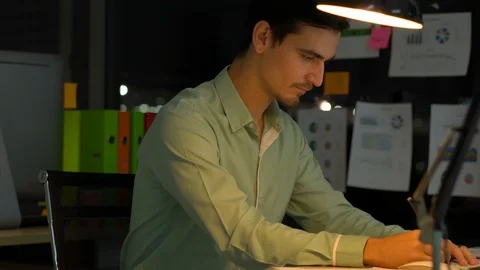 Businessman hard working with desktop computer to late night at office. Stock Footage 109392110