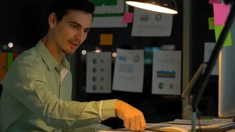 Businessman hard working with desktop computer to late night at office. Stock Footage 109393457