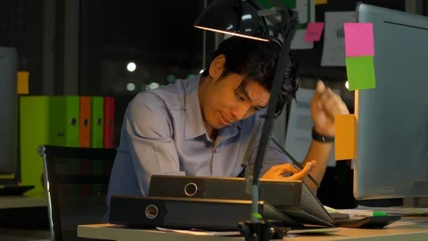 Businessman hard working with desktop computer to late night at office. Stock Footage 111653201