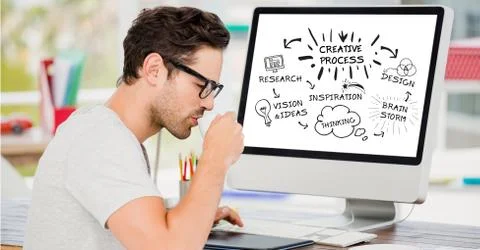 Businessman having coffee by computer with creative process planning Stock Photos