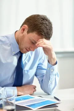 Businessman having problem in office Stockfoto's