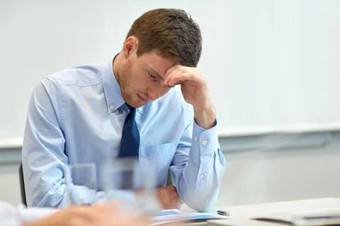 Businessman having problem in office Stockfoto's