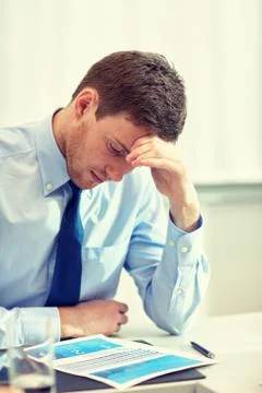 Businessman having problem in office Stockfoto's