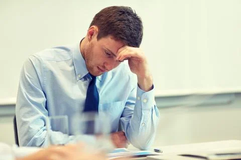 Businessman having problem in office Stockfoto's