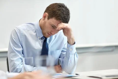 Businessman having problem in office Stockfoto's