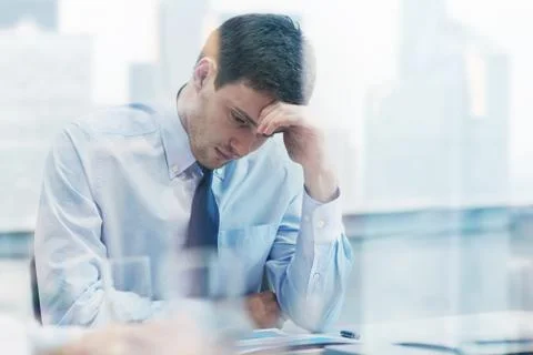 Businessman having problem in office Stockfoto's