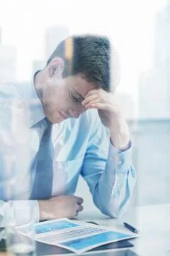 Businessman having problem in office Stockfoto's