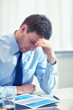 Businessman having problem in office Stockfoto's