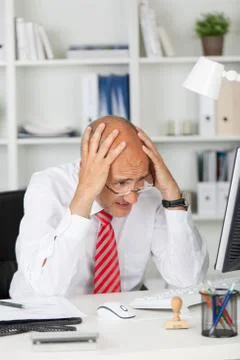 Businessman having problems with computer Stock Photos