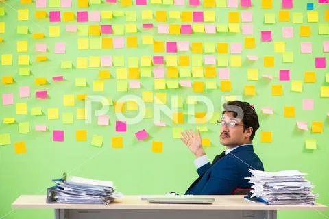 Businessman having trouble with his priorities Stock Photos