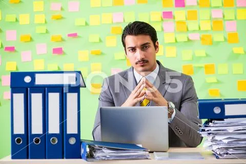 Businessman having trouble with his priorities Stock Photos