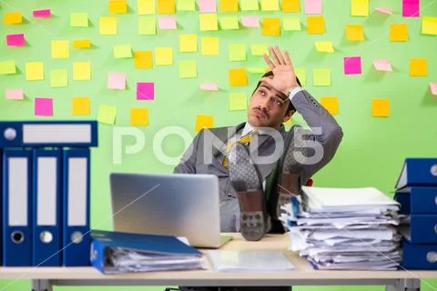 Businessman having trouble with his priorities Stock Photos