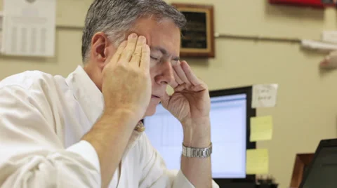 Businessman with a headache Stock Footage 30960645