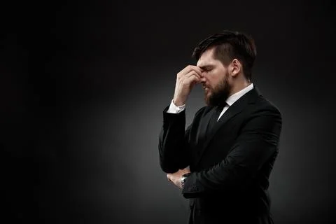 Businessman with a headache, gesturing Stock Photos