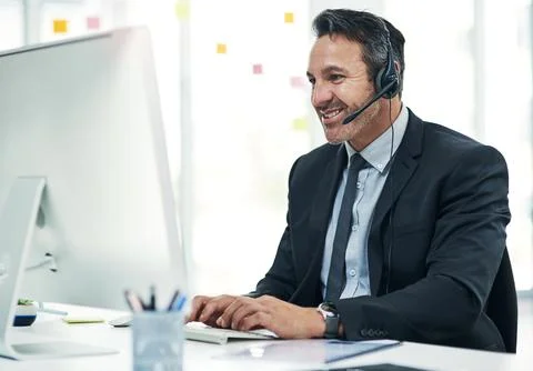 Businessman, headset and computer at call center with agent for customer su.. Fotos de archivo