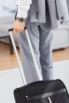 Businessman with his baggage Stock Photos