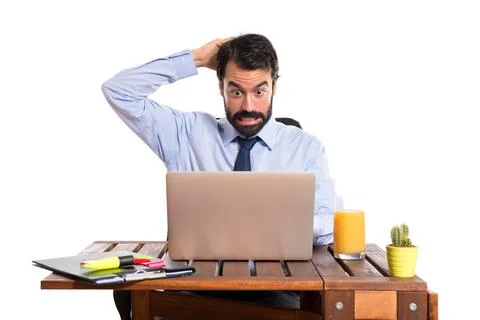 Businessman in his office having doubts Stock Photos
