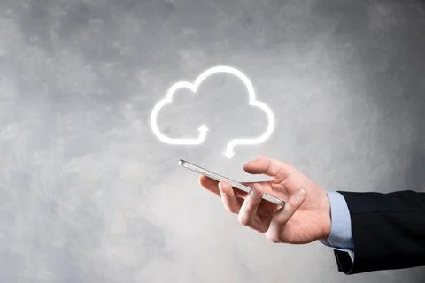 Businessman hold cloud icon.Cloud computing concept - connect smart phone to  Stock Photos