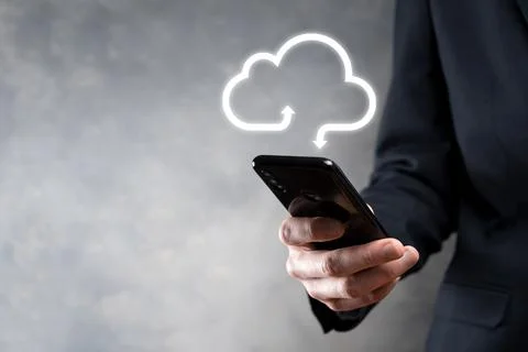Businessman hold cloud icon.Cloud computing concept - connect smart phone to  写真素材