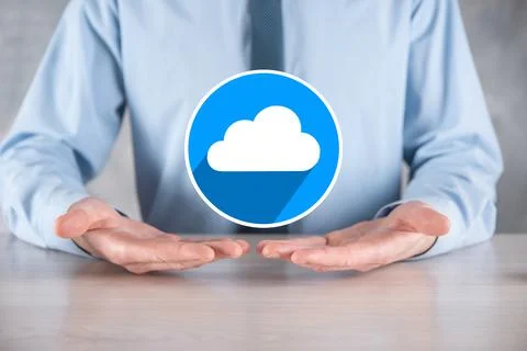 Businessman hold cloud icon.Cloud computing concept - connect smart phone to  Stock Photos
