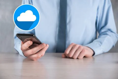 Businessman hold cloud icon.Cloud computing concept - connect smart phone to  Foto stock