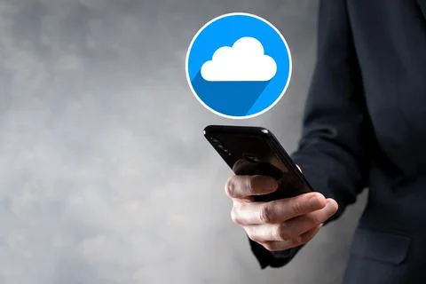 Businessman hold cloud icon.Cloud computing concept - connect smart phone to  Foto stock
