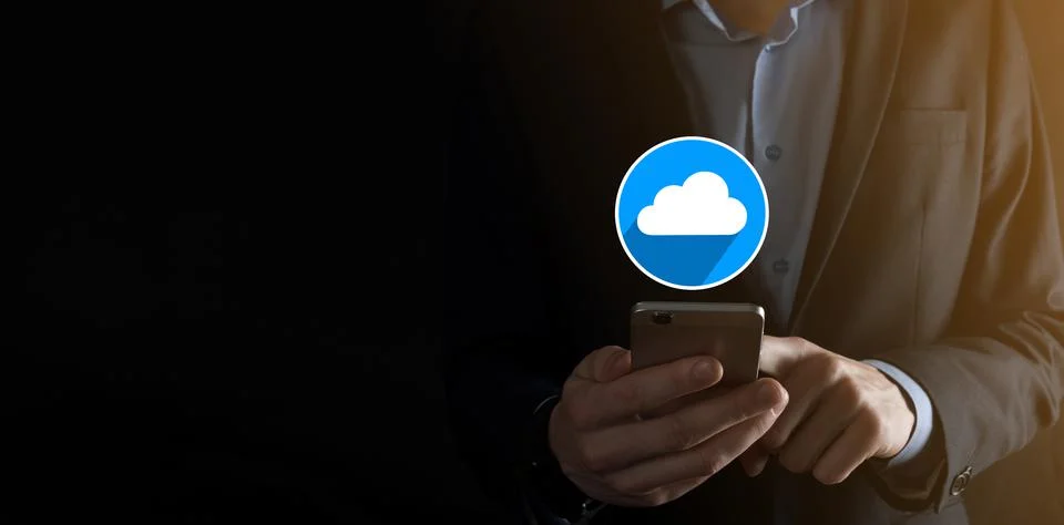 Businessman hold cloud icon.Cloud computing concept - connect smart phone to  스톡 사진