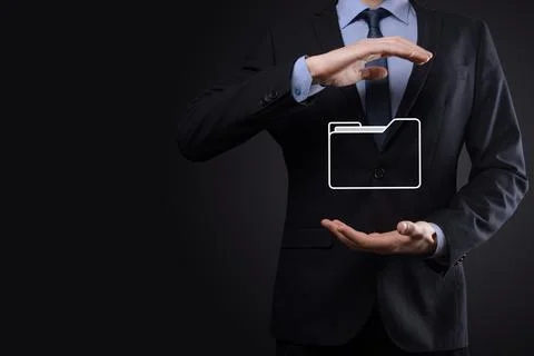 Businessman hold folder icon.Document Management System or DMS setup by IT co Stockfoto's