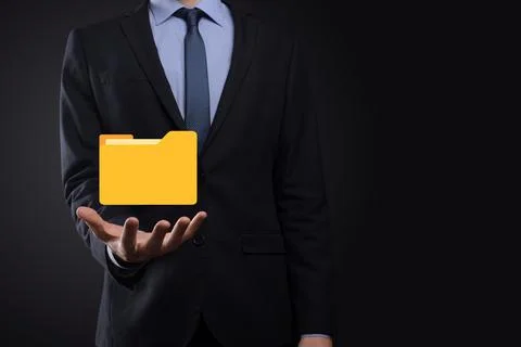 Businessman hold folder icon.Document Management System or DMS setup by IT co Stockfoto's