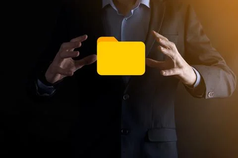 Businessman hold folder icon.Document Management System or DMS setup by IT co Stock Photos