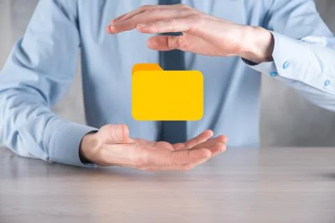 Businessman hold folder icon.Document Management System or DMS setup by IT co 写真素材