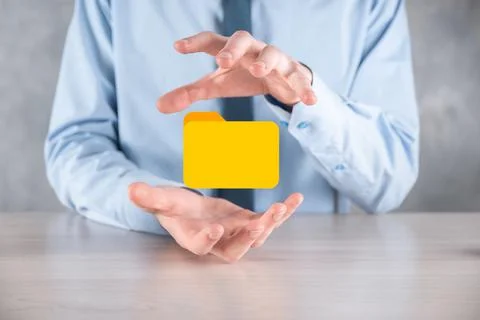 Businessman hold folder icon.Document Management System or DMS setup by IT co 写真素材