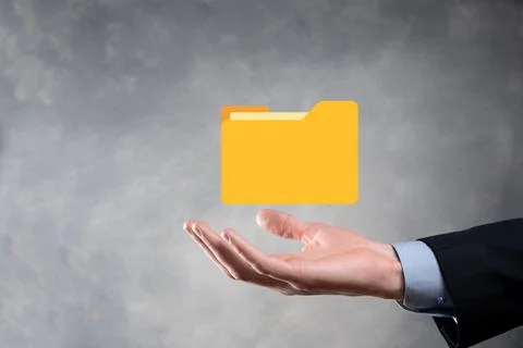 Businessman hold folder icon.Document Management System or DMS setup by IT co Stockfoto's
