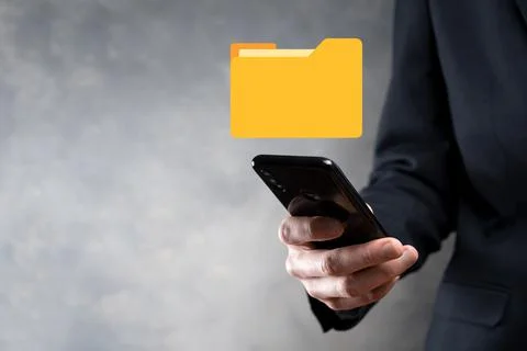 Businessman hold folder icon.Document Management System or DMS setup by IT co 写真素材